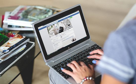 crowdsourcing woman browsing internet on laptop