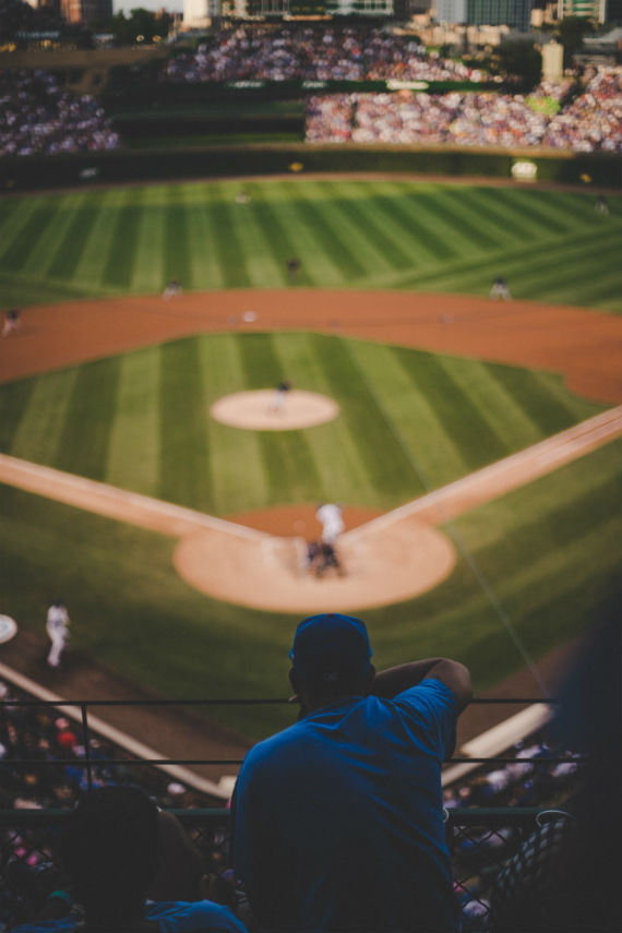find a life coach man looking at baseball field