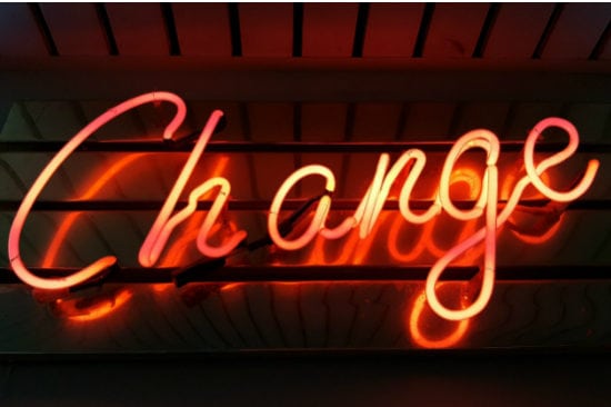 neon sign that says change